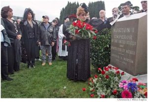 Jose Sarria, the Widow Norton, at the grave of Emperor Norton where she is now at rest.